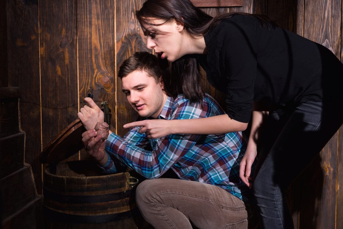 Two players examining a clue together in an escape room at Escape Time St Ives